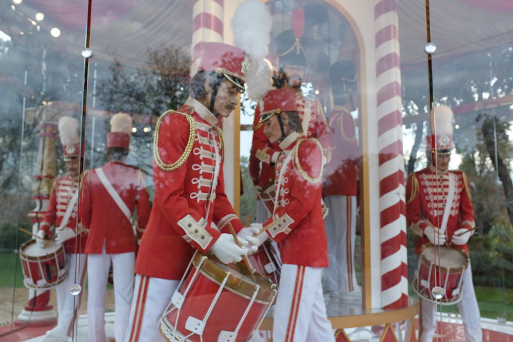 a group of men in red and white uniforms