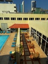 Outdoor pool area with lounge chairs