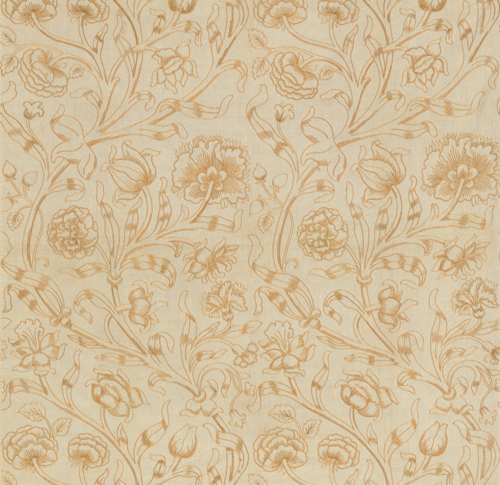 a beige background with flowers and leaves on it