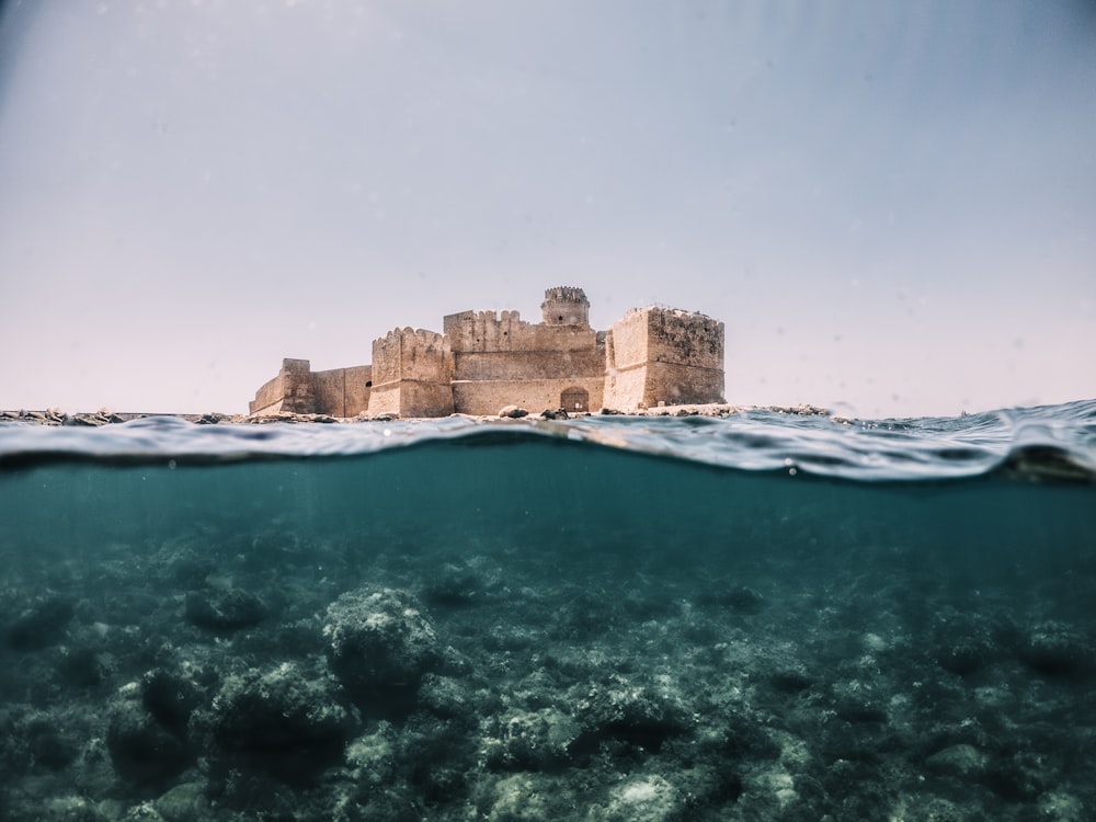 an underwater view of a castle in the ocean