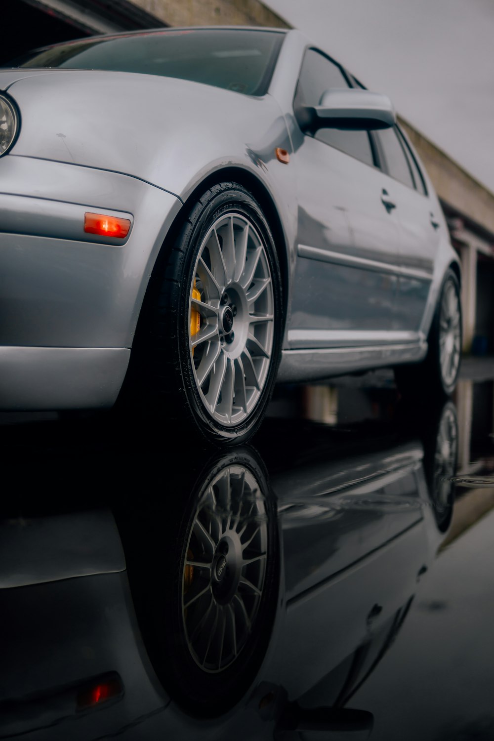 a silver car parked on the side of a road