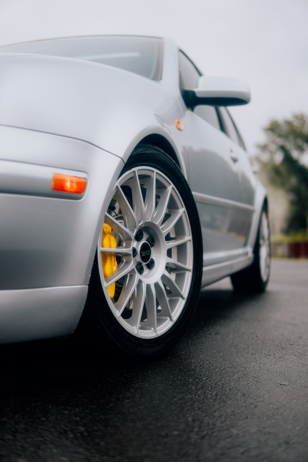 a silver car parked on the side of the road