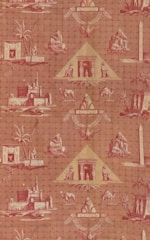 A patterned wallpaper featuring Egyptian motifs, including pyramids, sphinxes, camels, and palm trees. The design incorporates various Egyptian symbols and structures such as obelisks, making use of a reddish color palette.