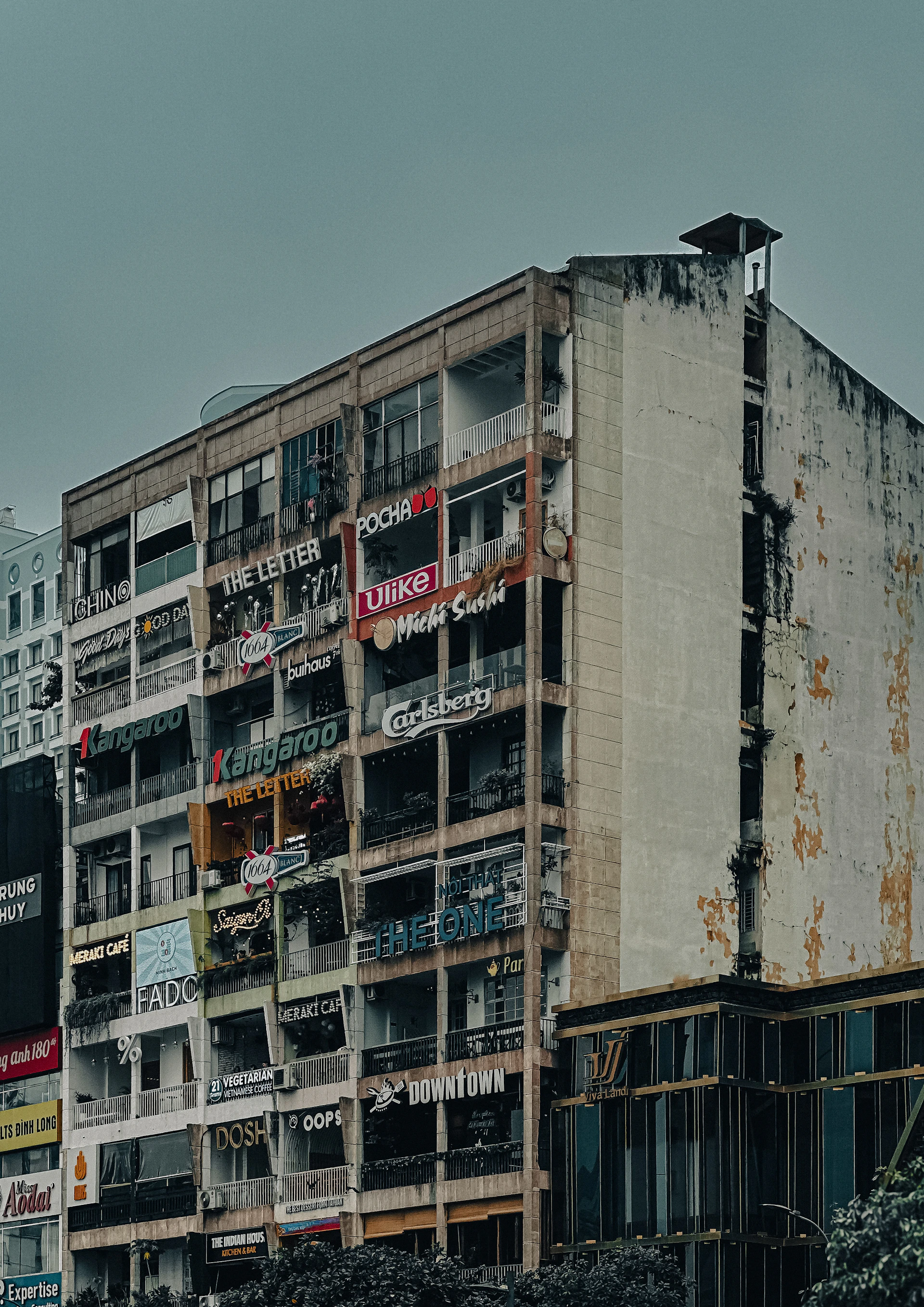woman wearing yellow long-sleeved dress under white clouds and blue sky during daytime