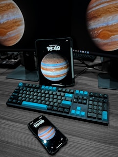 An inviting workspace with a laptop displaying astrological software alongside traditional charts and notes.