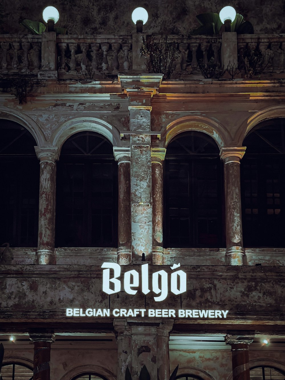 a building with a sign that says belgo on it