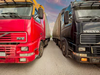 a couple of trucks parked next to each other