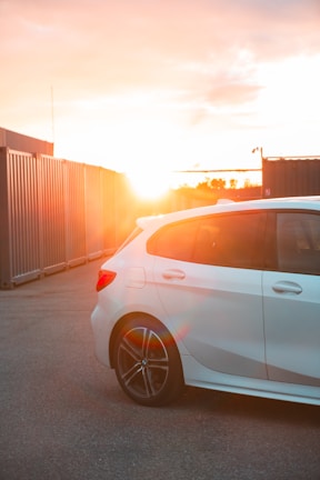 a white car parked in a parking lot