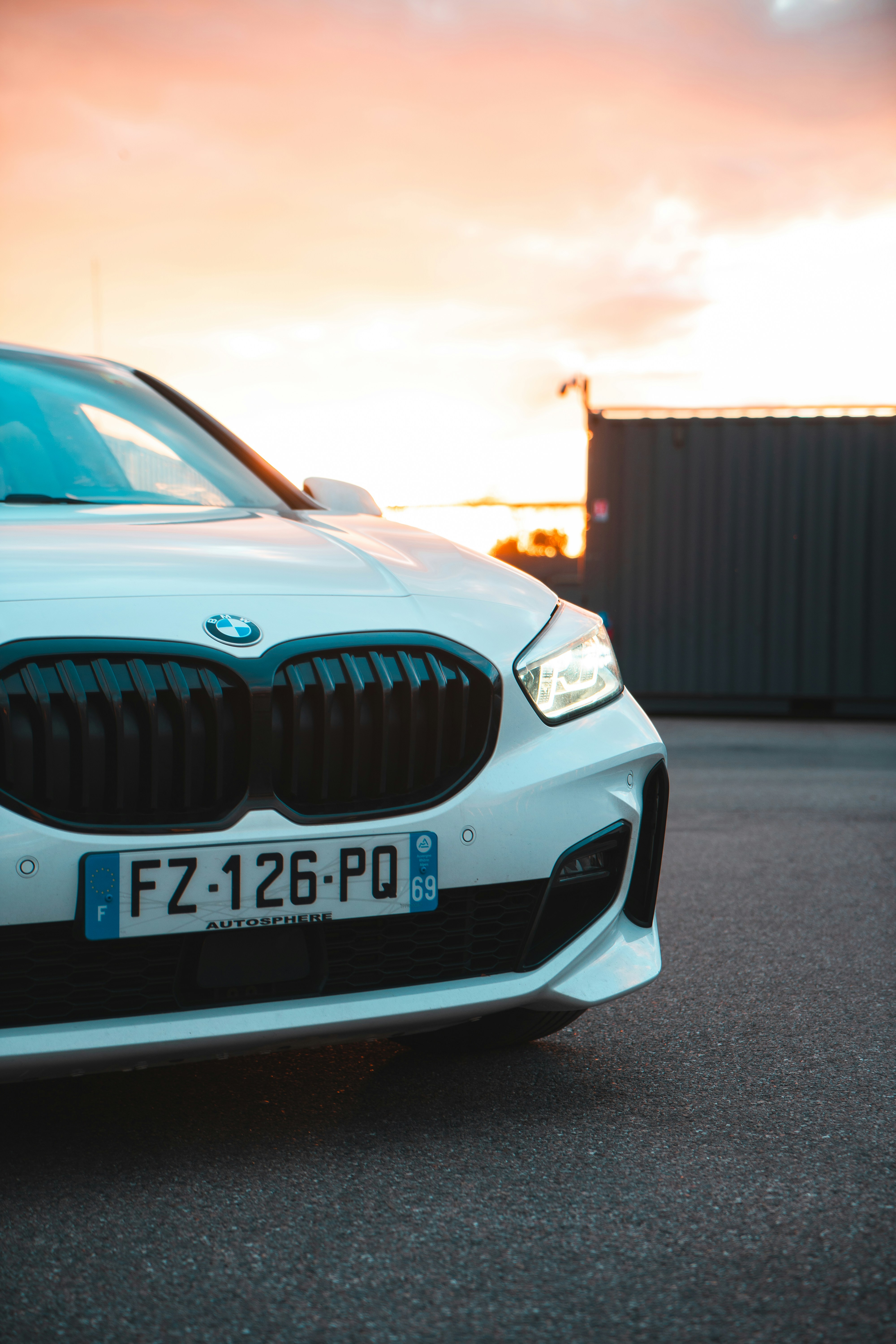 a white car parked in a parking lot