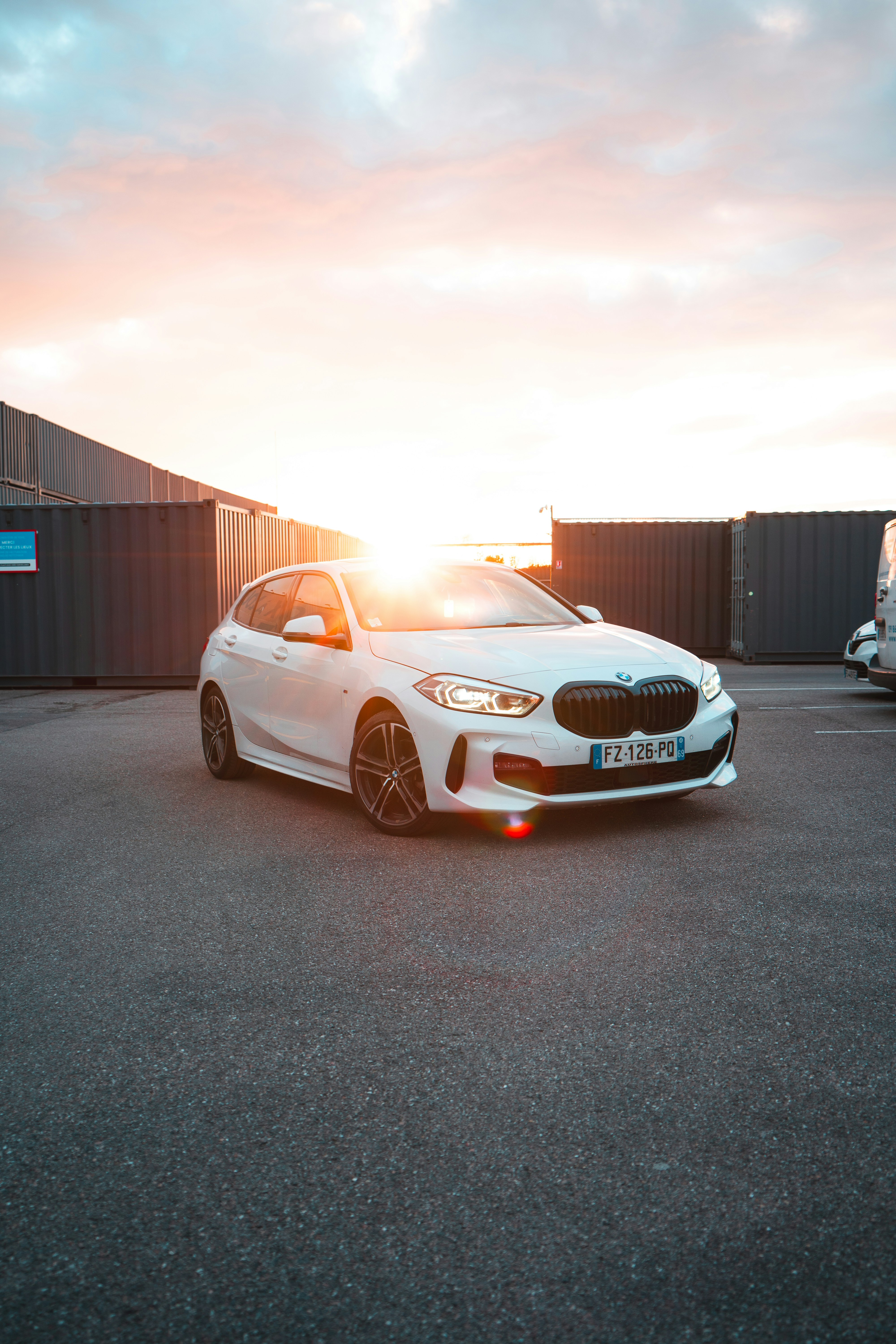 a white car parked in a parking lot