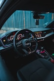 the interior of a car with dashboard lights and steering wheel