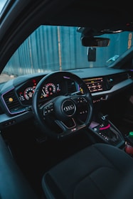 the interior of a car with dashboard lights and steering wheel