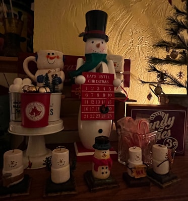 A warm, softly lit scene showing the advent calendar displaying days 1 to 24.