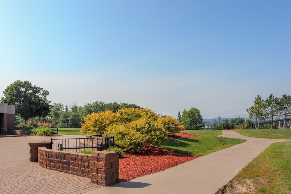 a park with a bench and a walkway