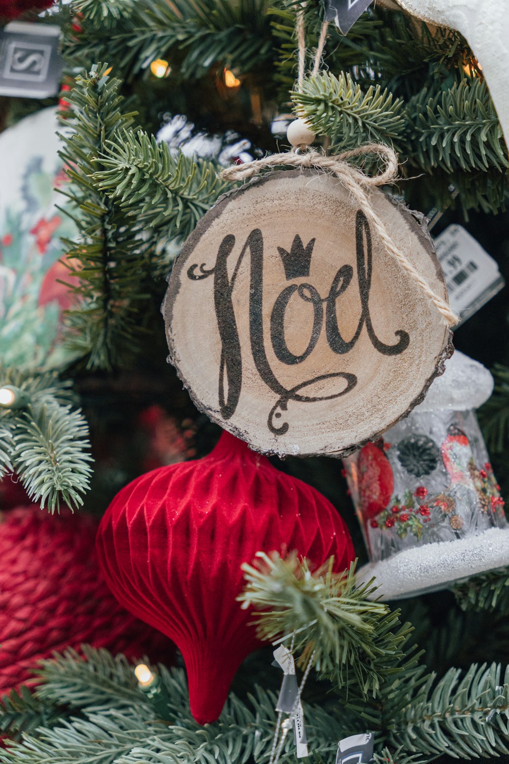 a close up of a christmas tree with ornaments