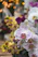 A close-up photo of a vibrant, freshly delivered orchid bouquet in a cozy home setting.