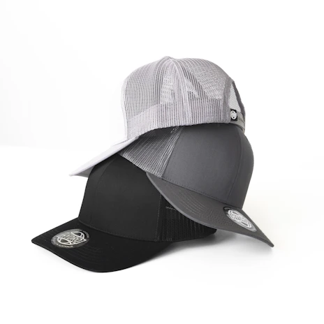 Three baseball caps are stacked on top of each other, with the top cap being white with a mesh design, the middle cap being gray, and the bottom cap being black. Each cap has a sticker on the brim featuring a circular logo.