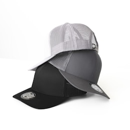 Three baseball caps are stacked on top of each other, with the top cap being white with a mesh design, the middle cap being gray, and the bottom cap being black. Each cap has a sticker on the brim featuring a circular logo.