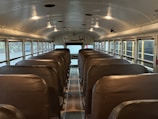 Interior view of a clean and organized school bus seating area.