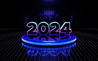 A futuristic setting featuring the glowing number 2024 prominently placed on a circular platform. The digits are illuminated with a blend of blue and purple hues. The background is a dark, perforated wall with a reflective floor that adds to the high-tech, digital aesthetic.