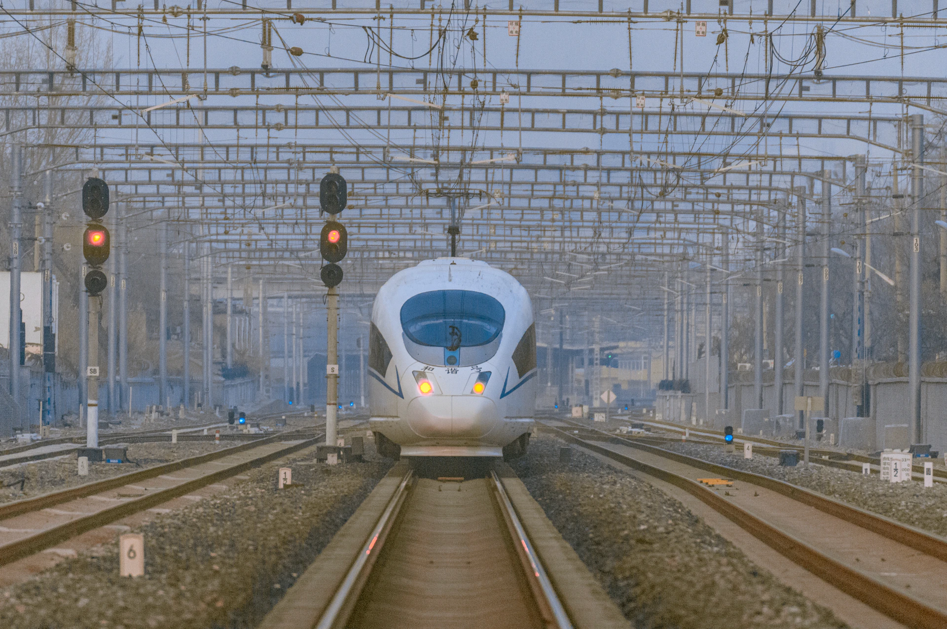 a white train traveling through a train station