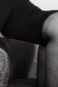 Close-up of a model wearing elegant veinity stockings, highlighting the fine texture and sleek design.