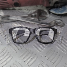 a pair of glasses sitting on top of a table