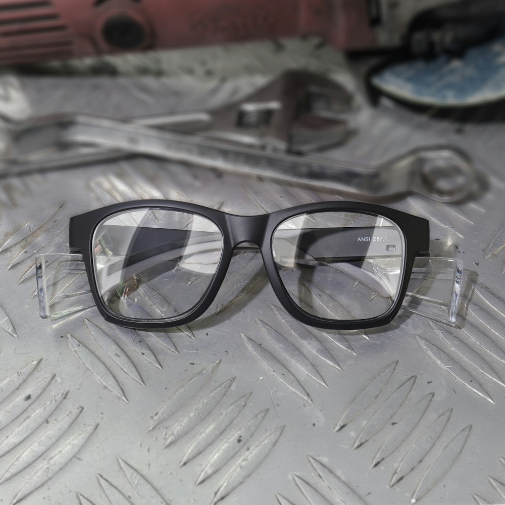 a pair of glasses sitting on top of a table