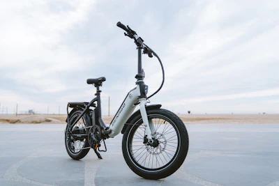 A sleek electric bicycle displayed in a modern urban setting.
