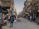 A bustling street scene in Bihar showing local vendors and daily commuters.