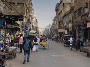 A bustling street scene in Bihar showing local vendors and daily commuters.