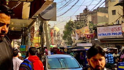 A vibrant street scene in Pakistan captured during a live news report.