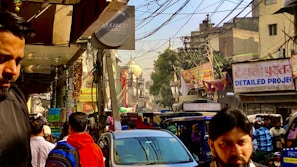 A busy street scene in Bhilawadi with people and vehicles moving about