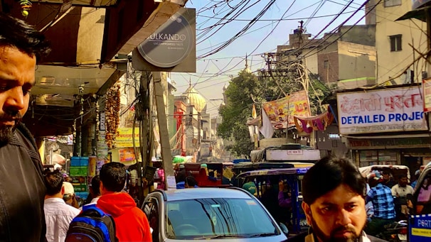 A bustling street in Durgapur with people heading to work and local businesses.
