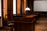 an empty room with chairs and a projector screen