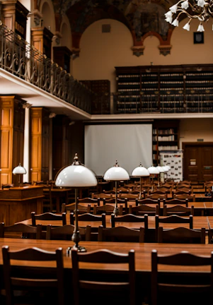 An elegant library setting showcasing the Global Scholar Review among other academic publications.