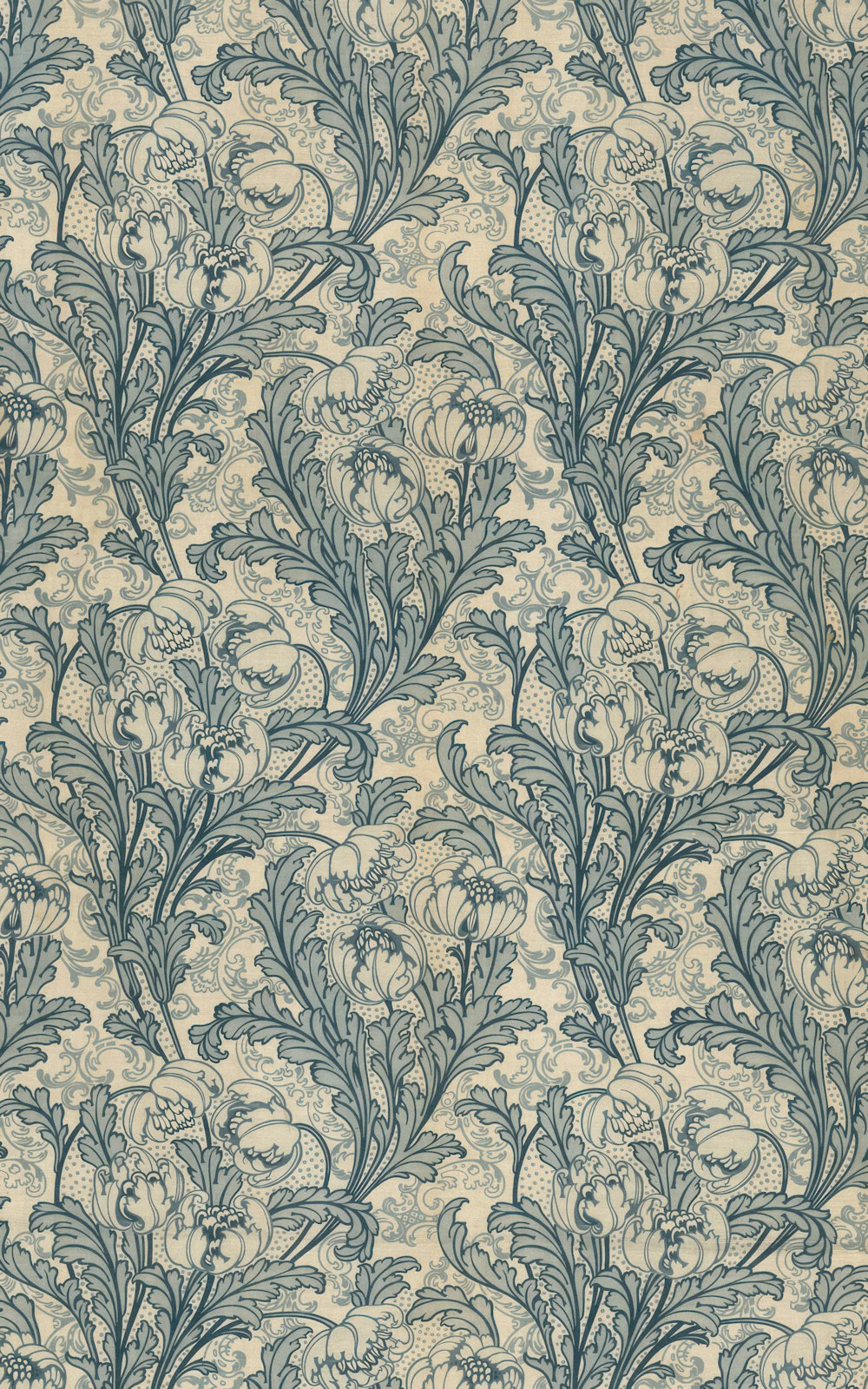 a blue and white wallpaper with a pattern of leaves