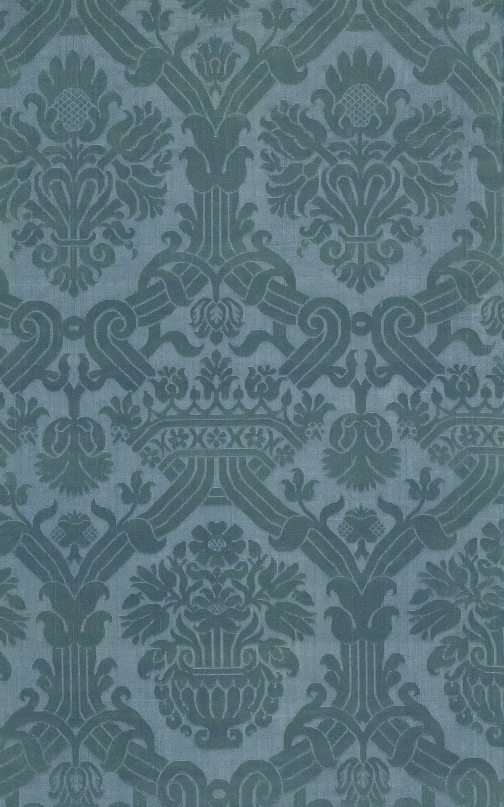 a blue and grey wallpaper with an ornate design