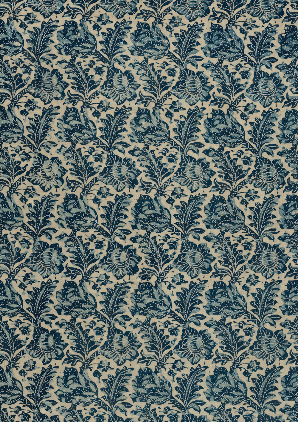 a blue and white wallpaper with a pattern of leaves