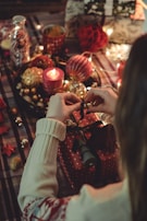 A joyful moment captured at a gift-wrapping station with colorful ribbons and wrapping paper.