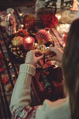 A cozy scene with a person opening a surprise gift.