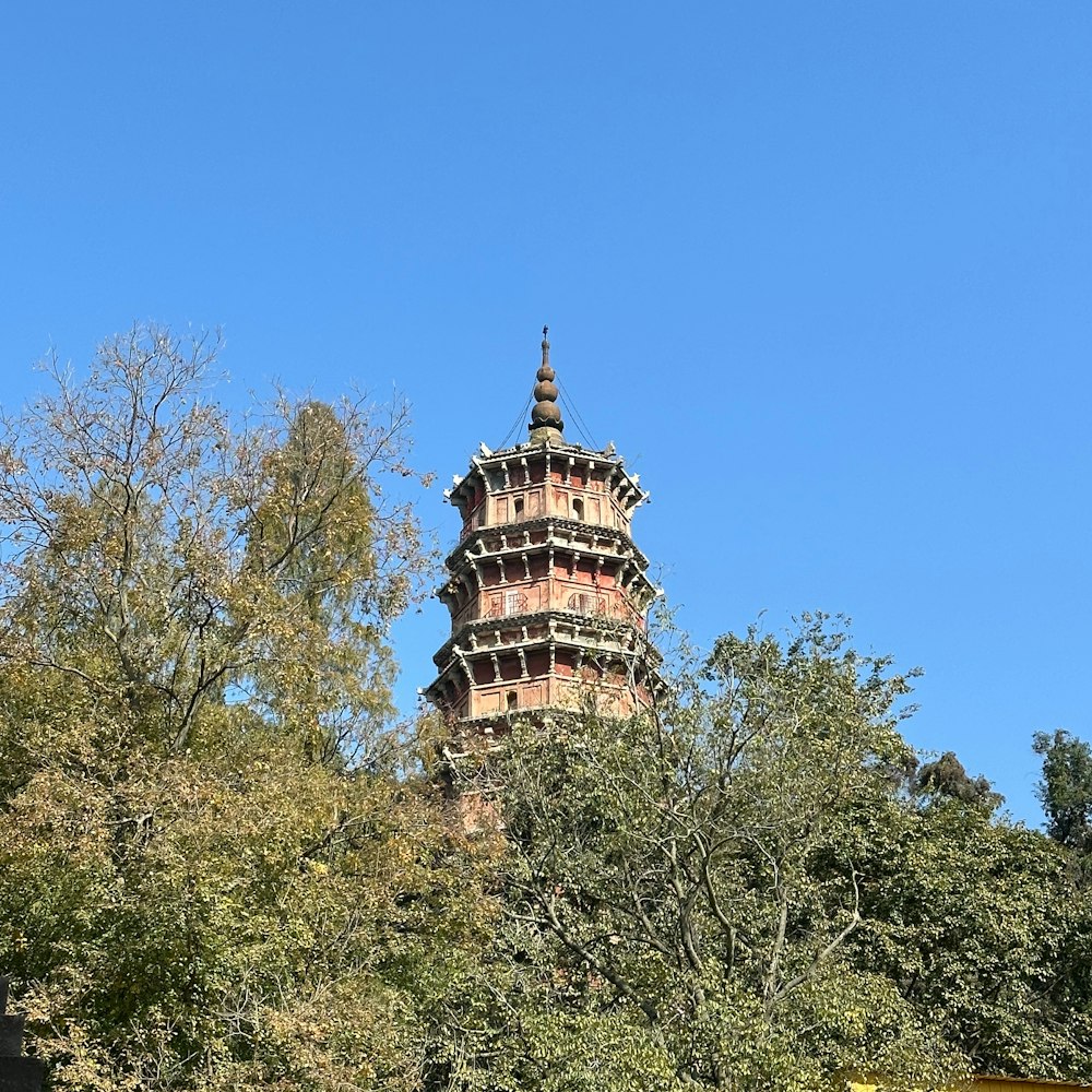 a tall tower with a clock on the top of it