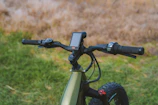 Close-up of a tricycle’s ergonomic handlebar and control panel.