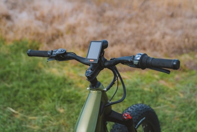 Close-up of a modern electric scooter's handlebar and display panel.