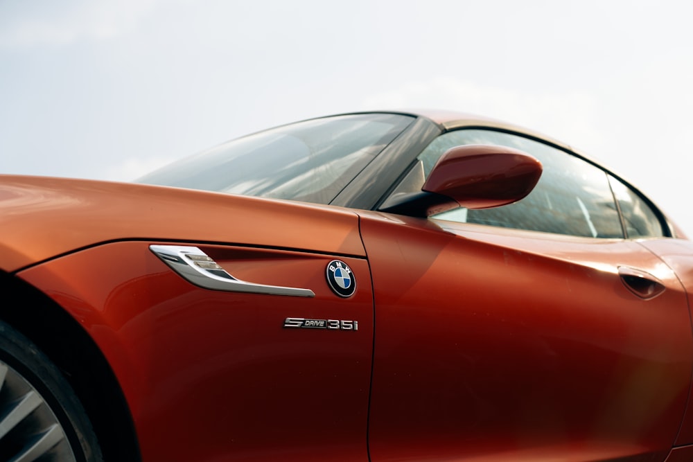 a close up of a red bmw sports car