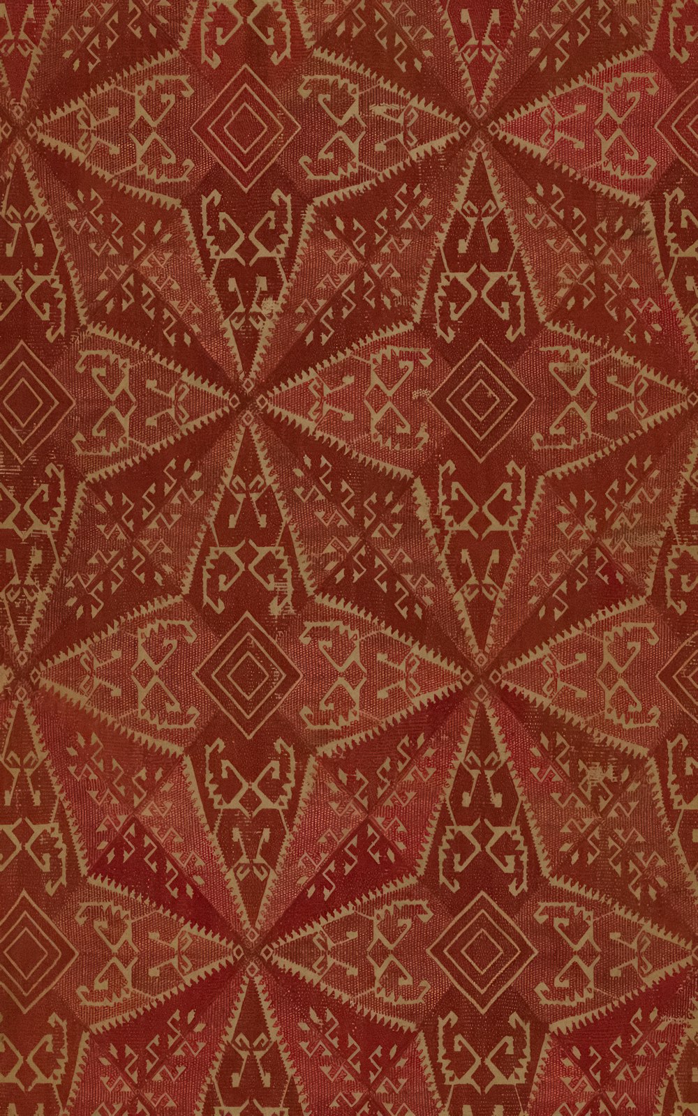 a close up of a red and gold pattern