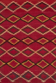 a red and yellow rug with a diamond pattern