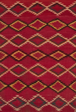 a red and yellow rug with a diamond pattern