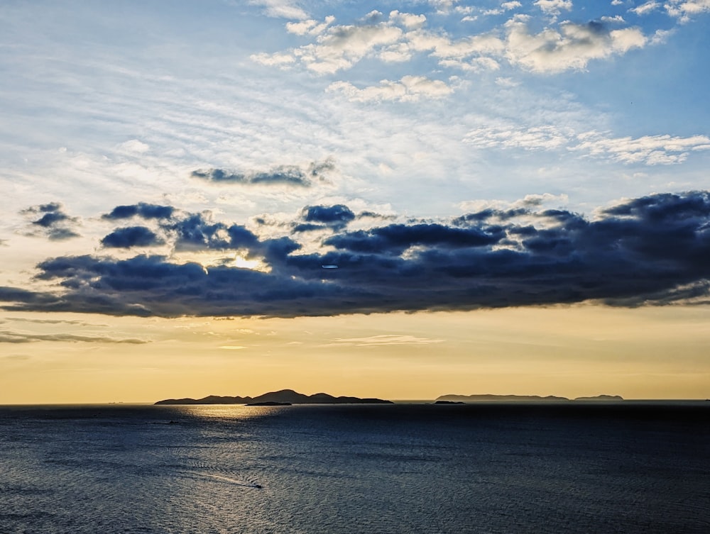 a body of water with a boat in the distance