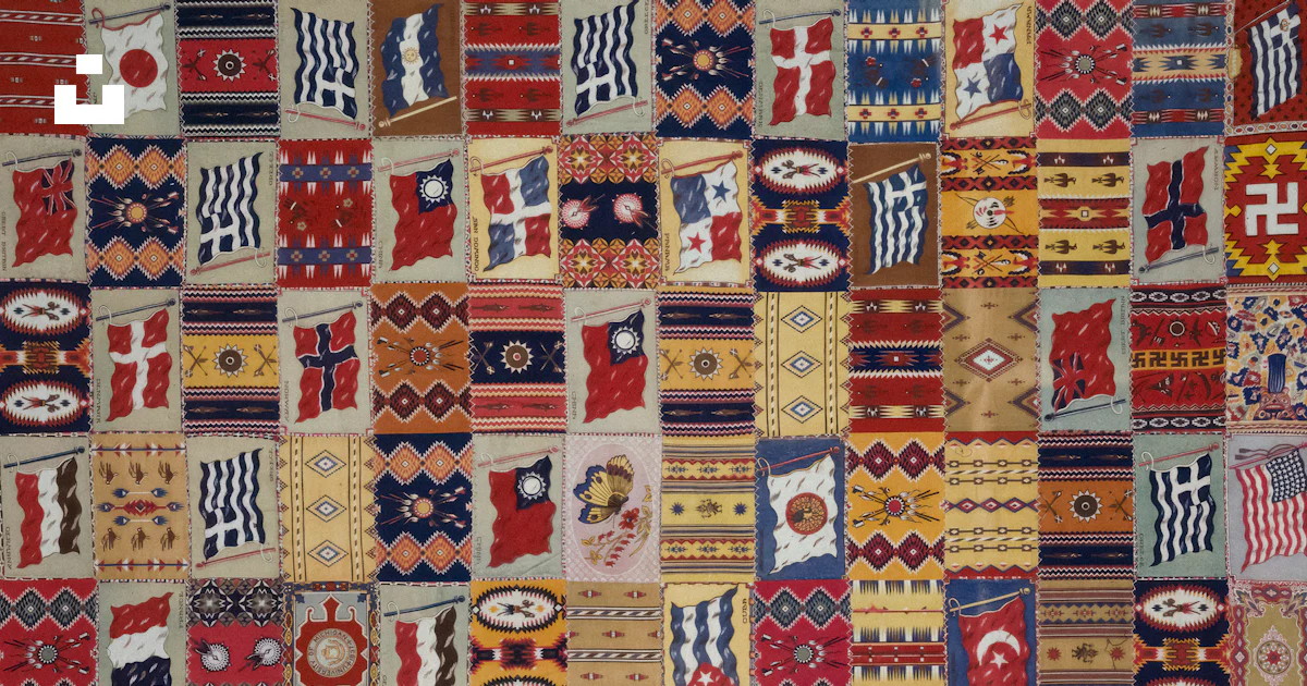 Patchwork Flags A patchwork wall hanging with a cross on it photo – Free Flags Image on ...
